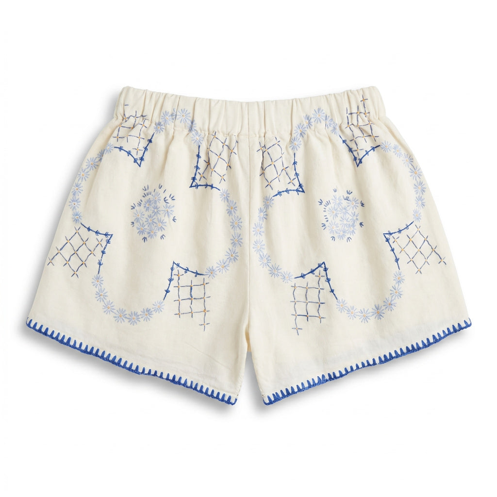 Shorts Cobalto DELAMIA — vista posteriore del ricamo geometrico blu su lino avorio