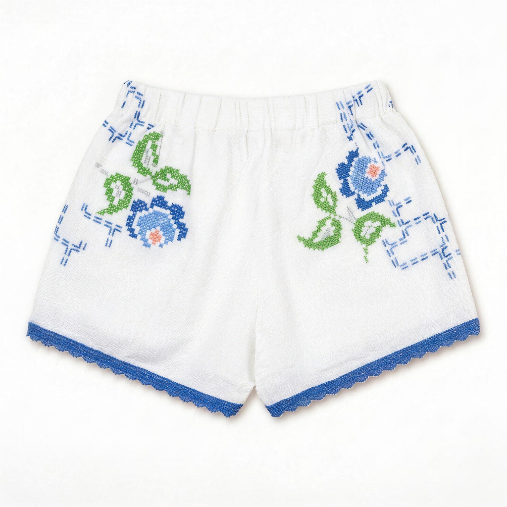 Shorts Verzura II DELAMIA — vista posteriore con foglie verdi e fiori