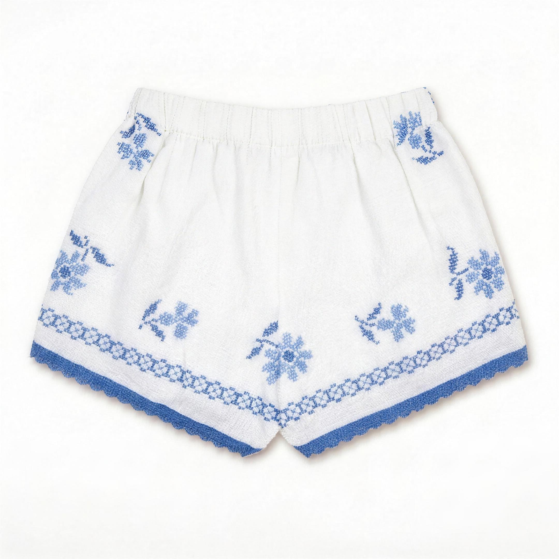 Shorts Verzura III DELAMIA — vista posteriore con foglie verdi e fiori