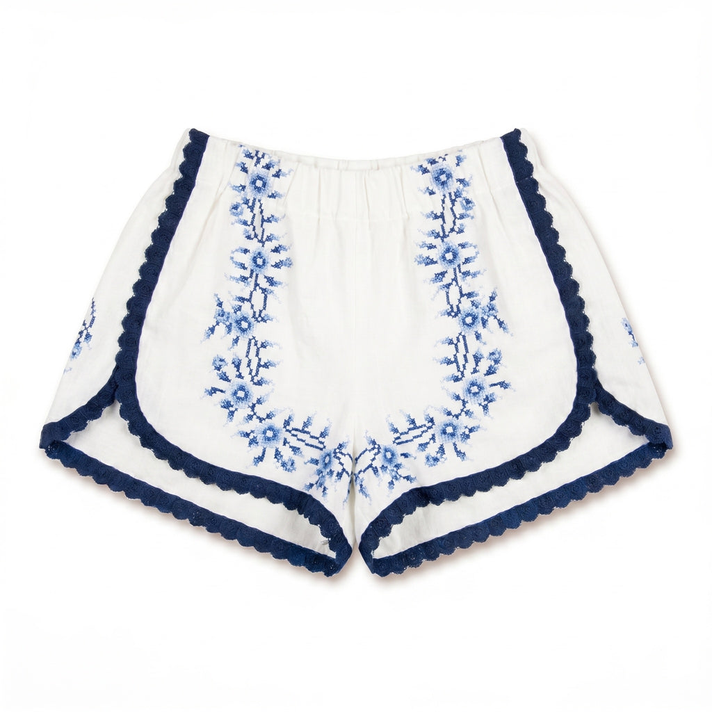 Shorts Indaco DELAMIA — tralci floreali blu navy su lino avorio, vista frontale