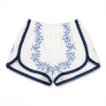 Shorts Indaco DELAMIA — tralci floreali blu navy su lino avorio, vista frontale