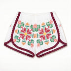 Shorts Tarantella DELAMIA — ricamo folk multicolore con bordo vinaccia, vista frontale