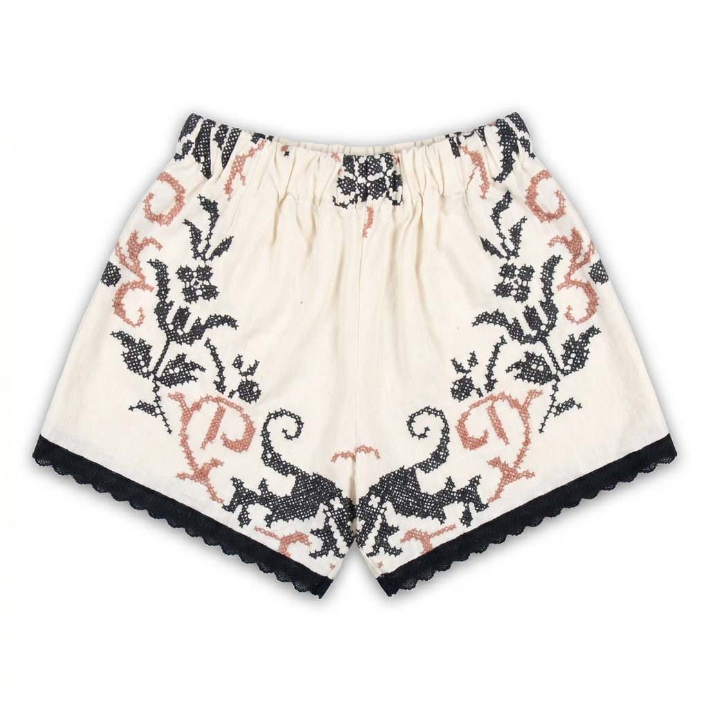 Shorts Vespro DELAMIA — vista posteriore del ricamo nero e terracotta su lino panna