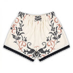 Shorts Vespro DELAMIA — vista posteriore del ricamo nero e terracotta su lino panna