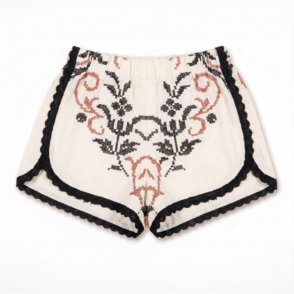 Shorts Vespro DELAMIA in lino panna con ricamo a punto croce nero e accento terracotta — vista frontale